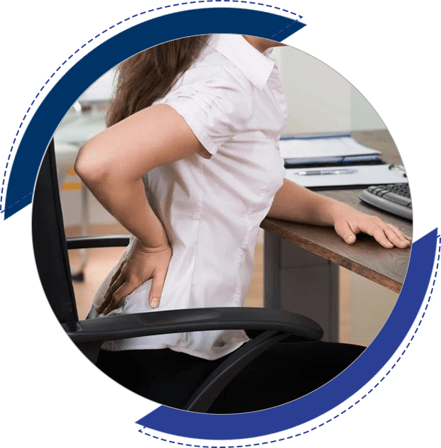 A woman sitting at the desk with her back turned.